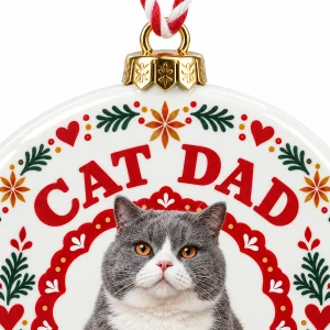 Close-up of the Cat Dad Scandinavian Folk Christmas Ornament print showing the cat's fur detail and the glossy porcelain