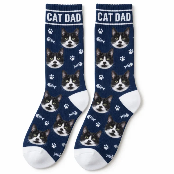 Cat Dad Socks with a black-and-white tuxedo cat and the text "CAT DAD", product photo on a white background