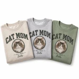 The Cat Mom Varsity Sweatshirt in three colors: heather sand, sport gray and sage green