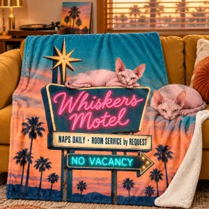 Cat Nap Motel Sign Blanket styled in a lifestyle scene – the blanket wrapped over a retro mustard couch with a record player in the background, warm sunset light through blinds