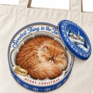 Close-up of the Christmas Cookie Tin Cat Tote Bag print showing the cat's fur detail and canvas tote bag