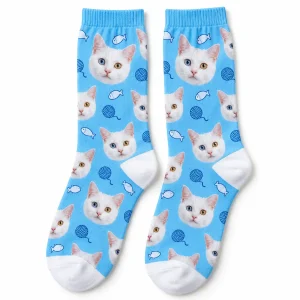 Custom Cat Face Socks with a white cat and a repeating cat face pattern, product photo on a white background