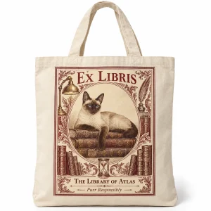 Cat book lover tote bag – Ex Libris Bookplate Cat Tote Bag with a seal-point Siamese and the text "Ex Libris", "The Library of Atlas", "Purr Responsibly", product photo on a white background