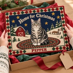 Hands unwrapping the Folk Hooked Rug Christmas Cat Rug from a kraft gift box
