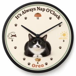 Personalized cat clock – It's Always Nap O'Clock Cat Wall Clock with a black-and-white tuxedo cat and the text "It's Always Nap O'Clock", "Oreo", product photo on a white background