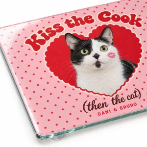 Close-up of the Kiss the Cook Then the Cat Valentine Cutting Board print showing the cat's fur detail and glass cutting board