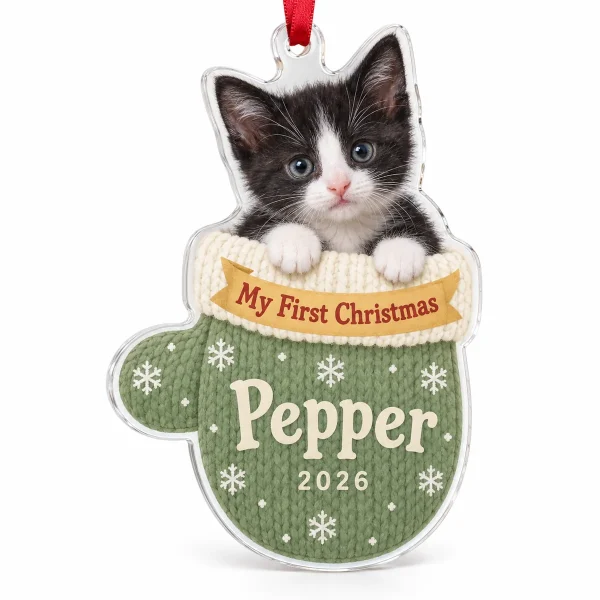 Personalized cat first christmas ornament – Kitten First Christmas Mitten Ornament with a tiny tuxedo kitten (black and white) and the text "My First Christmas", "Pepper", "2026", product photo on a white background